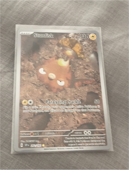 2023 Pokémon SV08: Surging Sparks #202/191 Stunfisk Illustration Rare — front