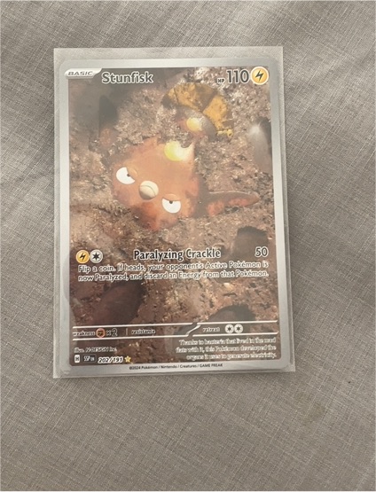 2024 Pokémon SV08: Surging Sparks #202/191 Stunfisk — front