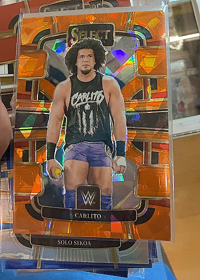 2024 Panini Select WWE #10 Carlito Orange Ice Prizm — front