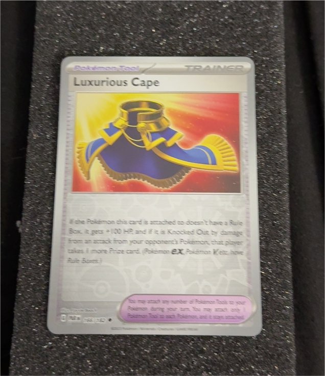 2023 Pokémon TCG Paradox Rift #166 Luxurious Cape — front