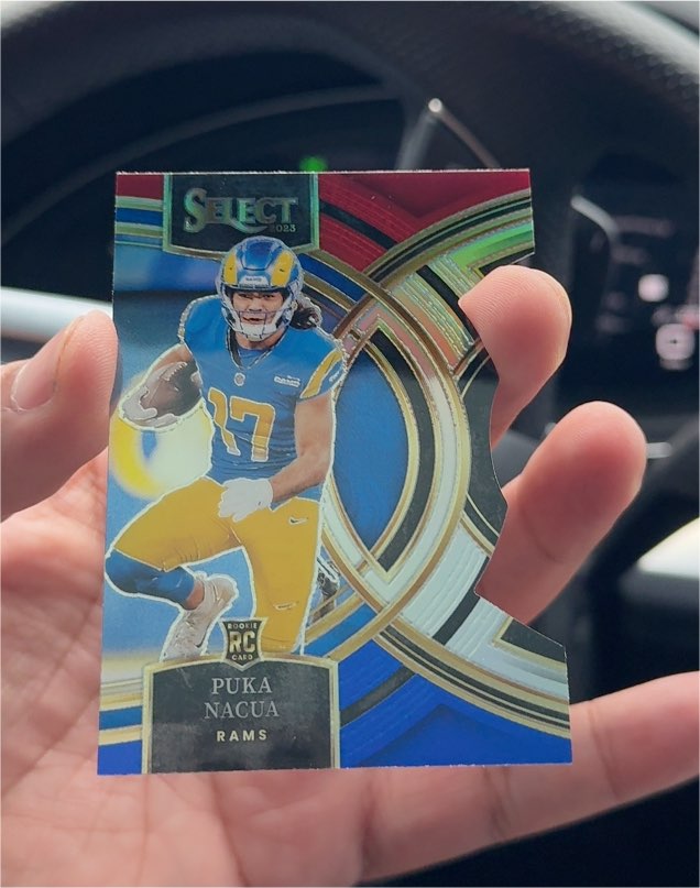 2023 Panini Select Premier Level Red & Yellow Prizm Die-Cut #199 Puka Nacua — front