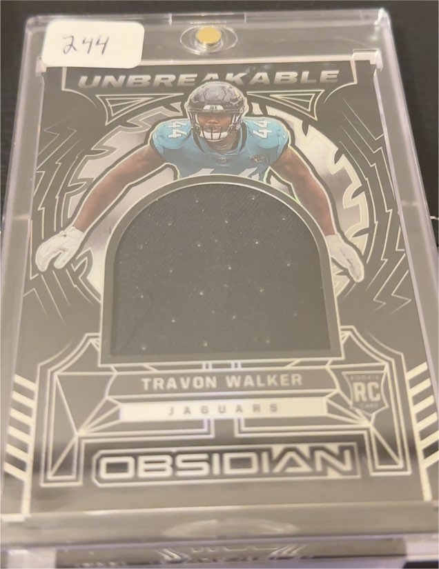 2022 Panini Obsidian Unbreakable #Travon Walker — front