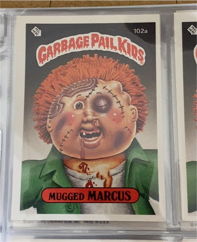 1986 Topps Garbage Pail Kids #102a Mugged Marcus — front