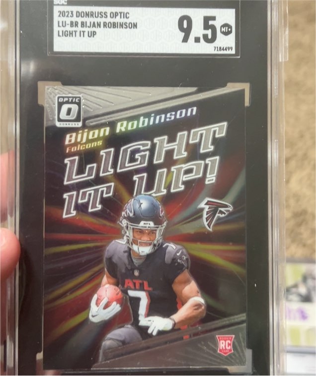 2023 Panini Donruss Optic #LU-BR Bijan Robinson Light It Up RC Falcons — front