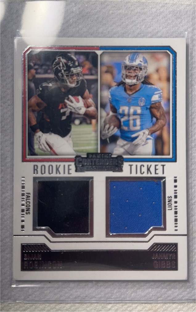2023 Panini Contenders Rookie Ticket Dual Swatches #DS-8 Bijan Robinson Jahmyr Gibbs — front