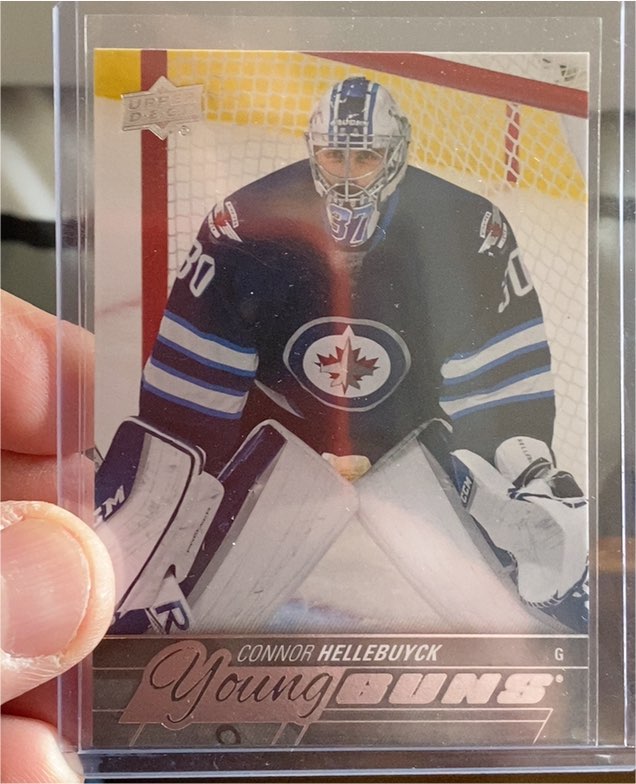 2015-16 Upper Deck #214 Connor Hellebuyck Young Guns Rookie Card — front