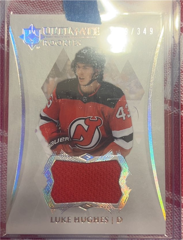 2023-24 Upper Deck Ultimate Collection Ultimate Rookies Jersey #102 Luke Hughes — front