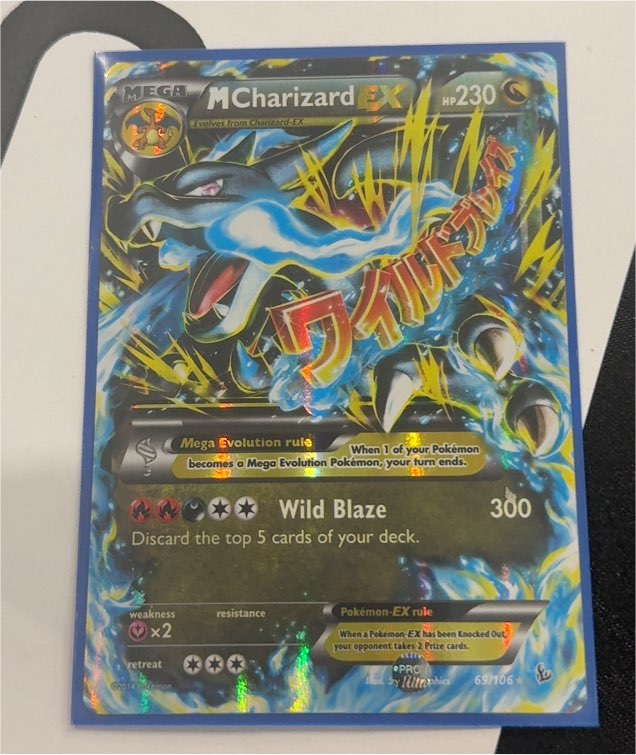 2014 Pokémon Flashfire #69 M Charizard EX — front