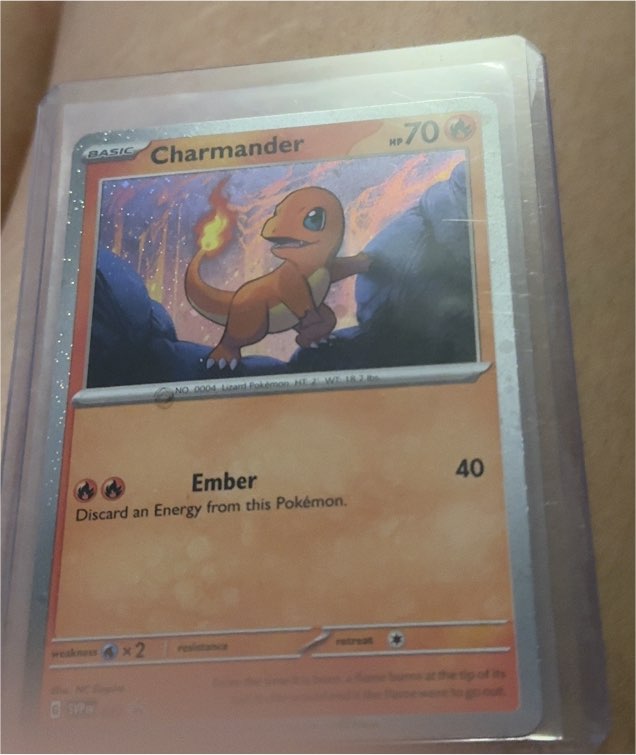 2023 Pokémon SVP 047 Charmander Cosmos Holo Black Star Promo Scarlet & Violet — front