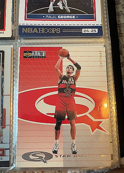 1997 Upper Deck Collector's Choice Star Quest #T8-133 Dikembe Mutombo — front