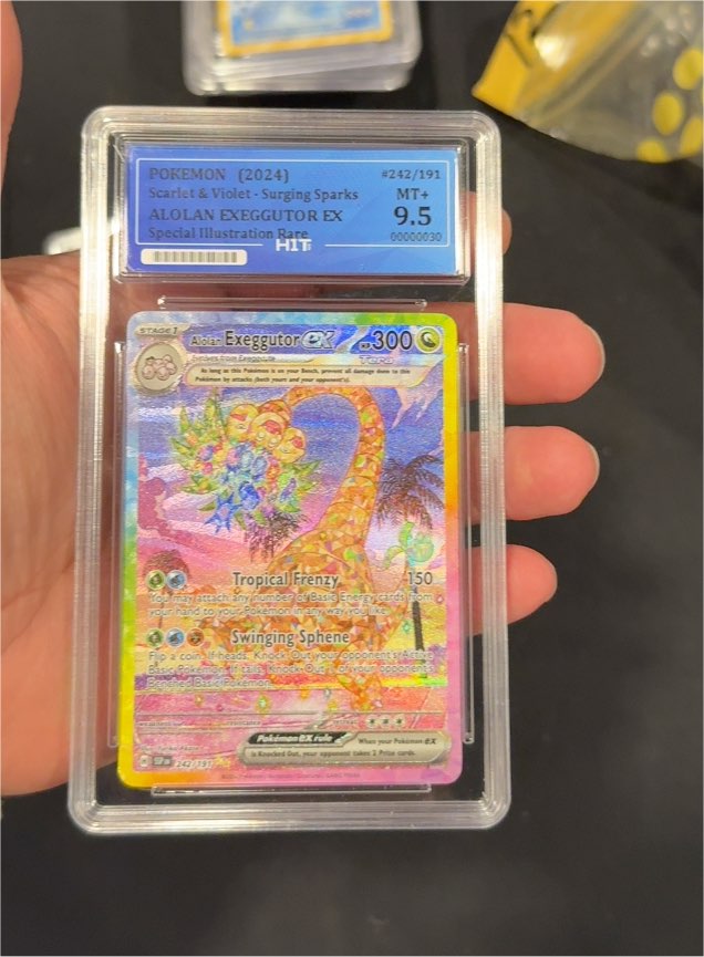 2024 Pokémon Scarlet & Violet Surging Sparks #242/191 Alolan Exeggutor ex Special Illustration Rare — front