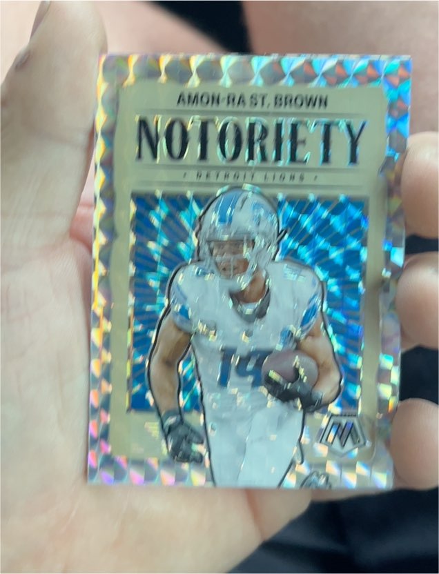 2024 Panini Mosaic Notoriety Mosaic Prizm #12 Amon-Ra St. Brown — front