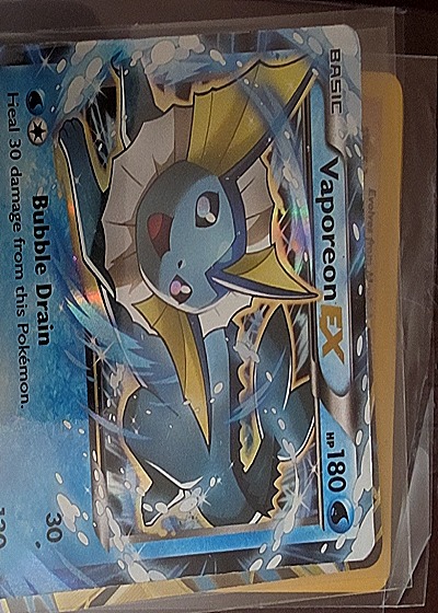 2014 Pokémon EX Delta Species #14 Vaporeon EX — front
