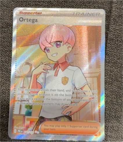 2025 Pokémon Scarlet & Violet Prismatic Evolutions #141/131 Ortega — front
