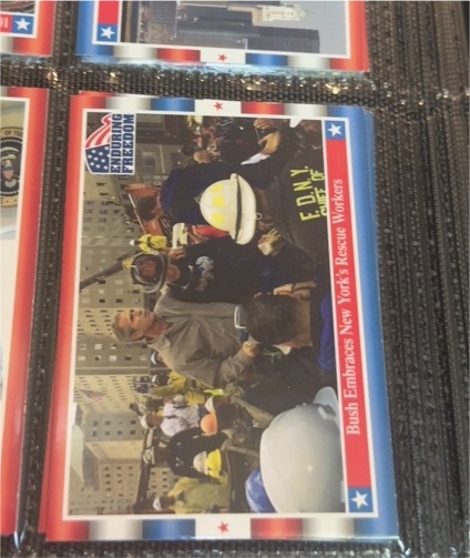 2001 Topps Enduring Freedom #6 George Bush, Embraces New York Rescue Workers — front