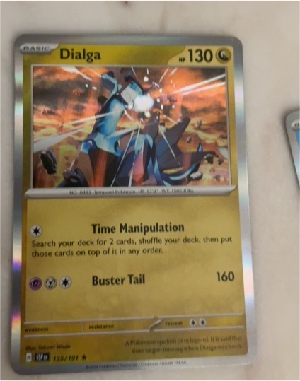 2024 Pokémon TCG Surging Sparks #135 Dialga — front