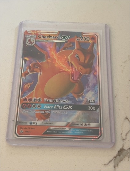 2019 Pokémon TCG Charizard GX #SM211 Black Star Promo — front