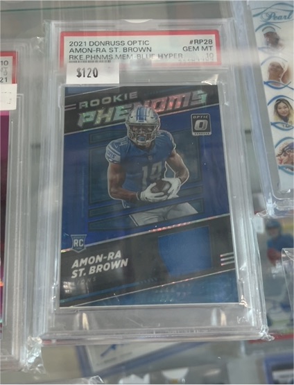 2021 Donruss Optic #RP28 Amon-Ra St. Brown Rookie Phenoms Blue Hyper — front