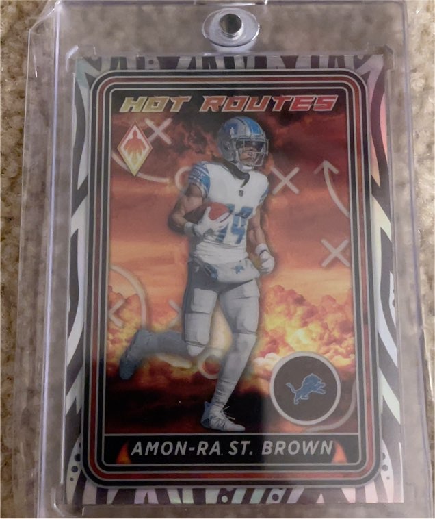 2023 Panini Phoenix Hot Routes #HR-3 Amon-Ra St. Brown — front