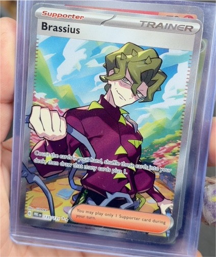 2025 Pokémon TCG Brassius 135/131 Prismatic Evolutions Full Art Trainer — front