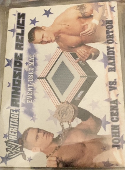 2007 Topps Heritage III WWE #NNO John Cena vs. Randy Orton Ringside Relics — front