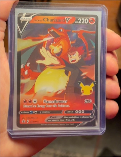 Lance's Charizard V SWSH133 Celebrations Black Star Promo — front