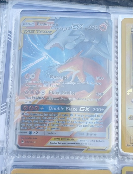 2019 Pokémon TCG SM Unbroken Bonds #20/214 Reshiram & Charizard GX — front