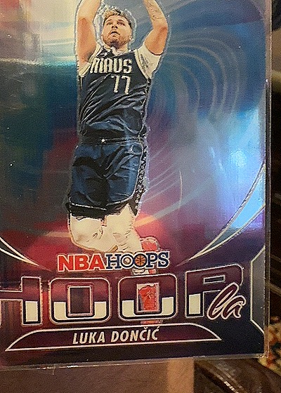 2023-24 Panini NBA Hoops Premium Stock #7 Luka Dončić Hoopla Silver Prizm — front