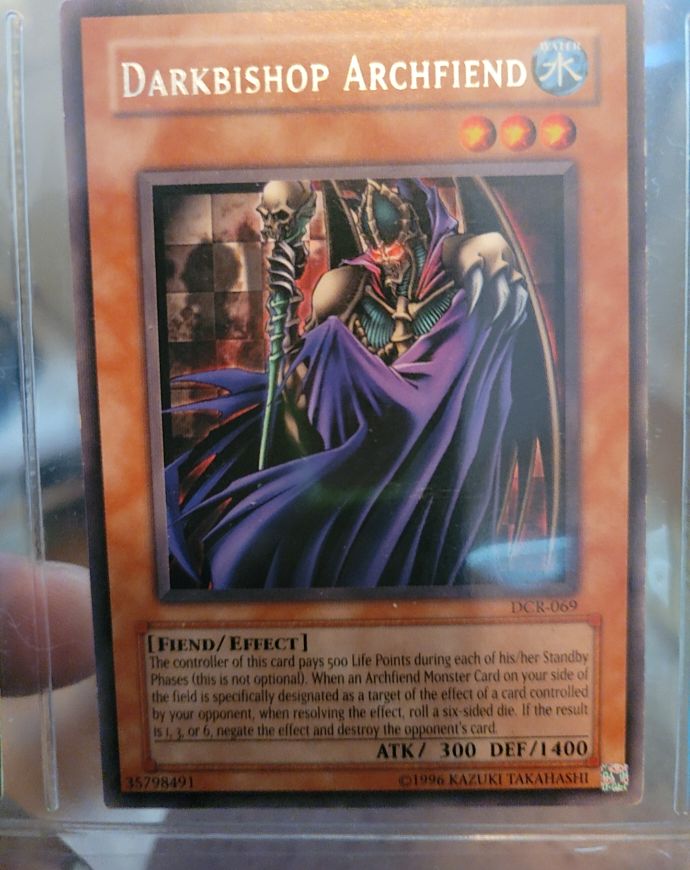 2003 Yu-Gi-Oh! Darkbishop Archfiend #DCR-069 — front