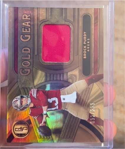 2024 Panini Gold Standard Gold Gear #GG-BP Brock Purdy — front