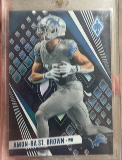 2023 Panini Phoenix #64 Amon-Ra St. Brown — front