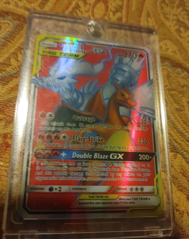 2019 Pokémon TCG Unbroken Bonds #194 Reshiram & Charizard GX — front
