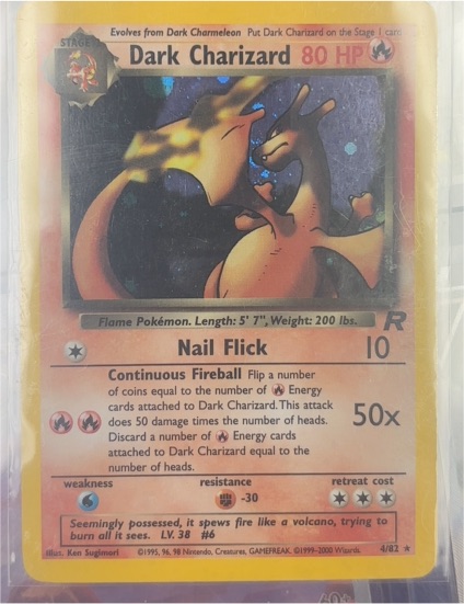 1999 Pokémon Team Rocket #4 Dark Charizard — front
