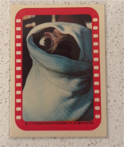 1982 Topps E.T. The Extra-Terrestrial Sticker #3 E.T. Bundled Up — front