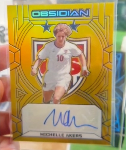 2024-25 Panini Obsidian Soccer Michelle Akers #/199 Auto — front