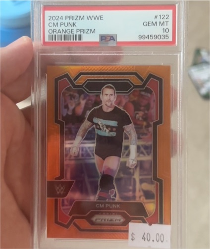 2024 Panini Prizm WWE #122 CM Punk Orange Prizm — front