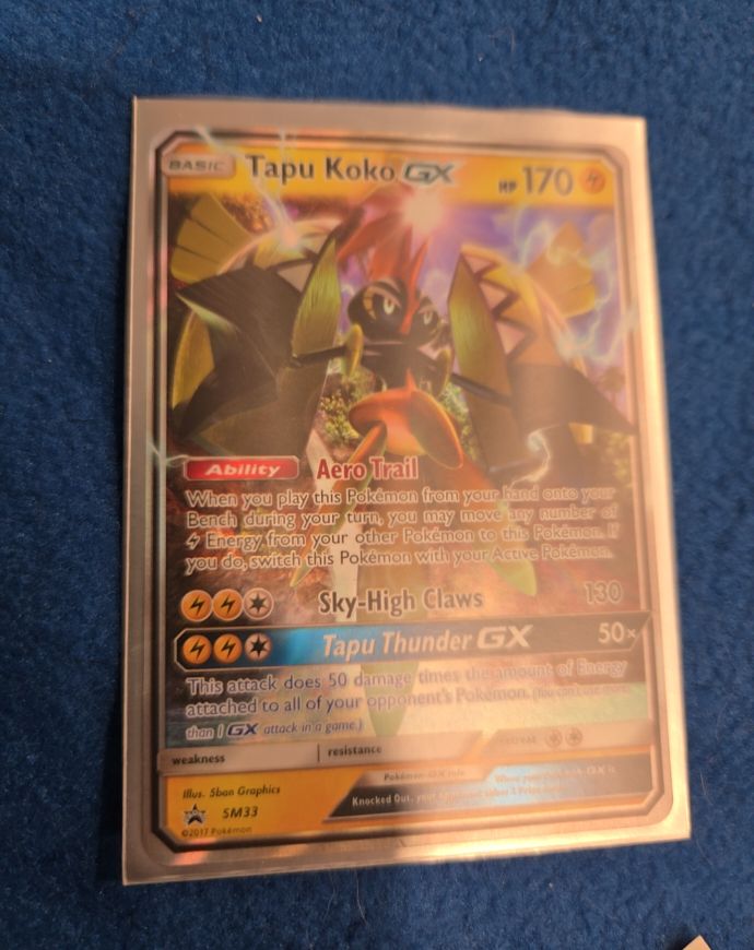 2017 Pokémon SM Black Star Promo #SM33 Tapu Koko GX — front