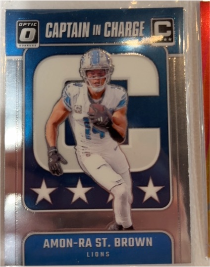 2024 Donruss Optic #5 Amon-Ra St. Brown Captain In Charge Detroit Lions — front