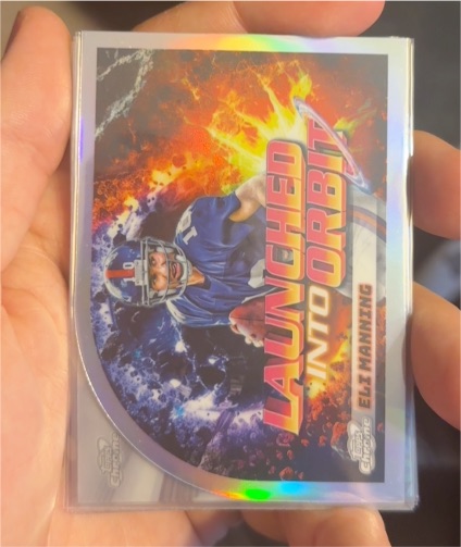2024 Topps Chrome Cosmic #LIO-24 Eli Manning Launched Into Orbit — front