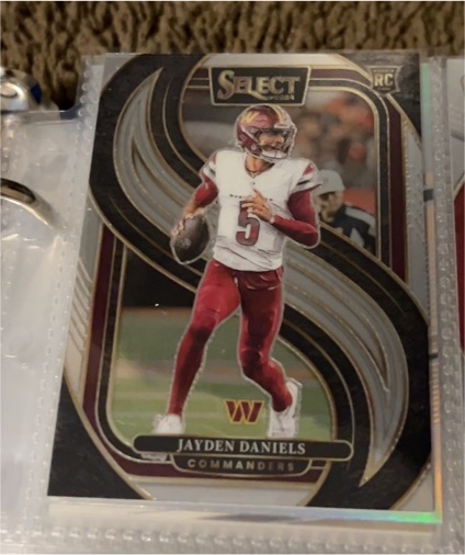 2024 Panini Select #112 Jayden Daniels Premier Level Rookie Card — front