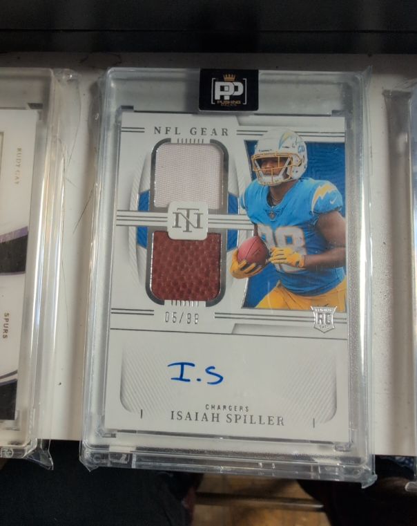 2022 Panini National Treasures NFL Gear #NFL Gear Isaiah Spiller — front