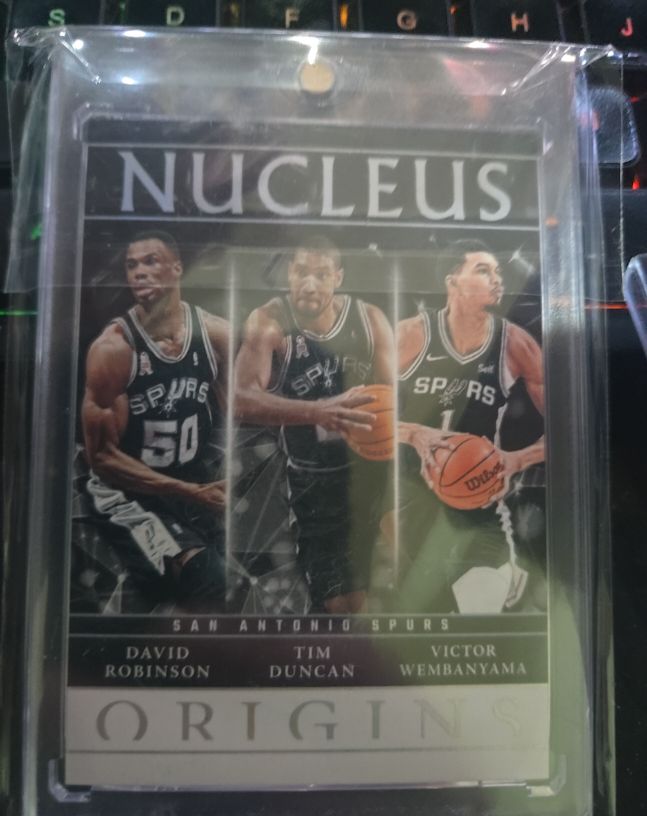 2024-25 Panini Origins Nucleus #17 David Robinson, Tim Duncan, Victor Wembanyama — front