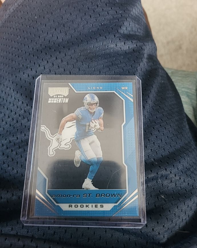 2021 Panini Chronicles Playoff Momentum #PMR-28 Amon-Ra St. Brown — front