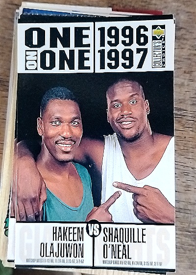1996-97 Upper Deck Collector's Choice #357 Hakeem Olajuwon & Shaquille O'Neal One on One — front