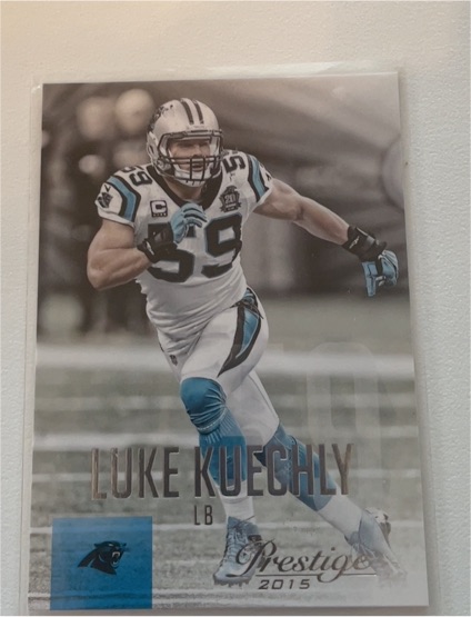 2015 Panini Prestige #141 Luke Kuechly — front
