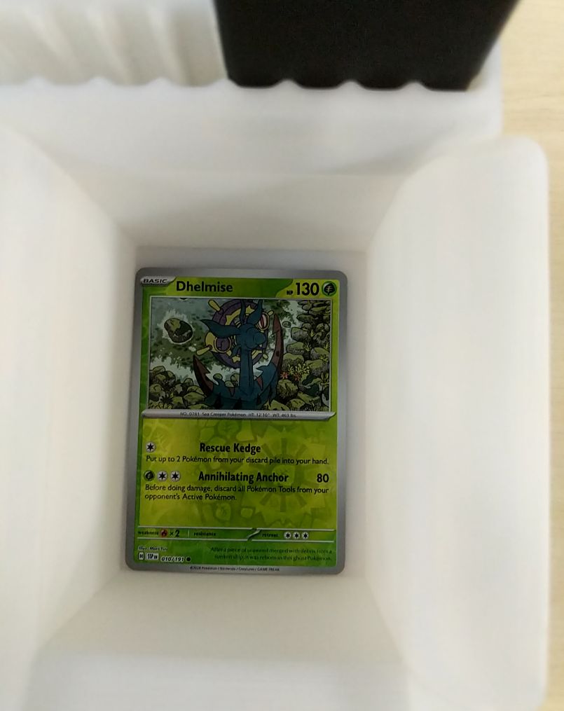 2023 Pokemon SV08 Surging Sparks #010 Dhelmise — front