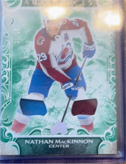 2024-25 Upper Deck Artifacts Emerald Materials #13 Nathan MacKinnon — front