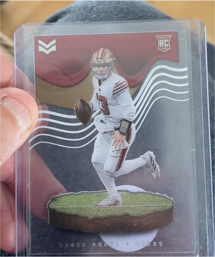 2022 Panini Chronicles Magnitude #MAG-27 Brock Purdy — front
