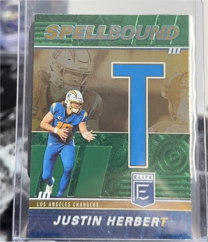 2022 Panini Donruss Elite #SB-JH7 Justin Herbert Spellbound Green T — front