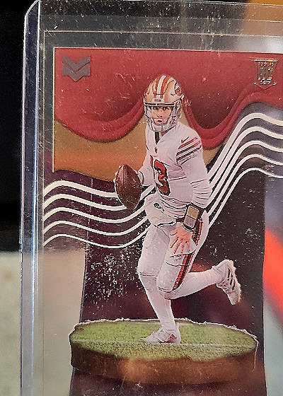 2022 Panini Chronicles Magnitude #MAG-27 Brock Purdy — front